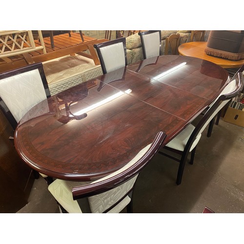 34 - DARK ROSEWOOD AND MARQUETRY EFFECT PEDESTAL EXTENDING DINING TABLE AND EIGHT CHAIRS