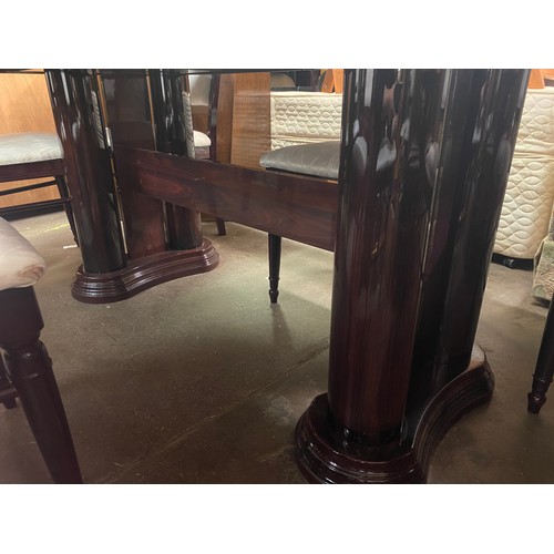 34 - DARK ROSEWOOD AND MARQUETRY EFFECT PEDESTAL EXTENDING DINING TABLE AND EIGHT CHAIRS