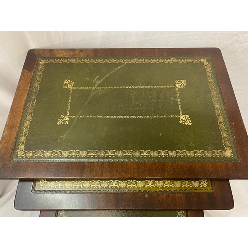 45 - NEST OF THREE MAHOGANY GREEN LEATHER TOPPED TABLES