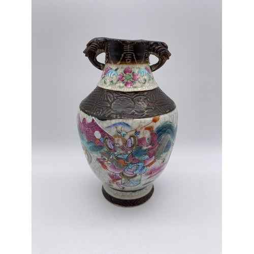 364 - CHINESE CRACKLE GLAZE TWIN HANDLE VASE WITH WARRIORS IN BATTLE 20CM H