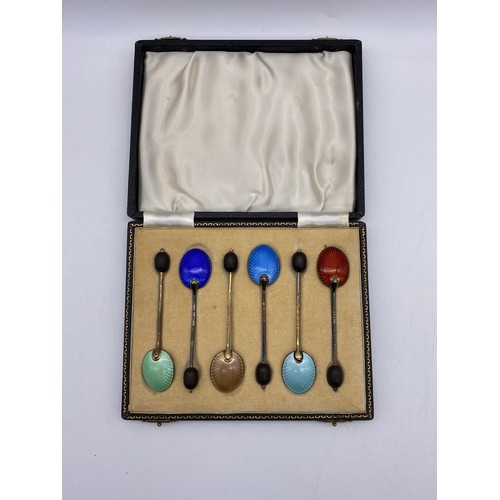 384 - CASED SET OF SIX BIRMINGHAM SILVER AND GUILLOCHE ENAMEL COFFEE TEASPOONS