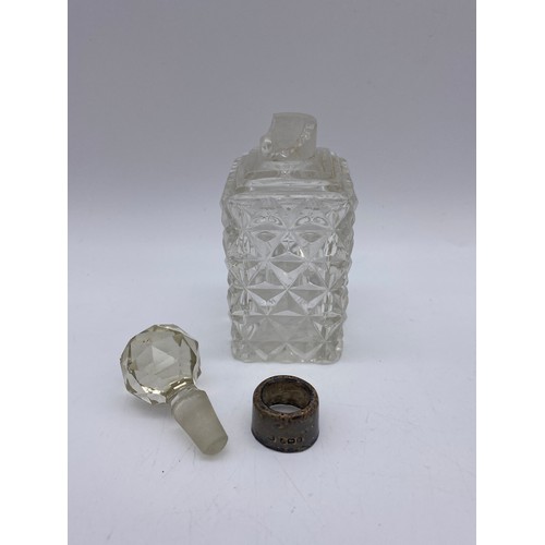 385 - BIRMINGHAM SILVER MINIATURE CREAMER 1.4OZ APPROX AND A SILVER TOPPED GLASS SCENT BOTTLE