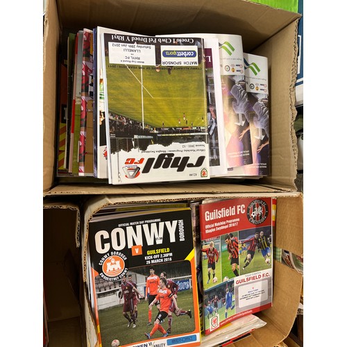 325 - TWO BOXES APPROX 300 WELSH LEAGUE FOOTBALL TEAMS PROGRAMMES AND EUROPEAN TEAMS AND NOW DEFUNK CLUBS