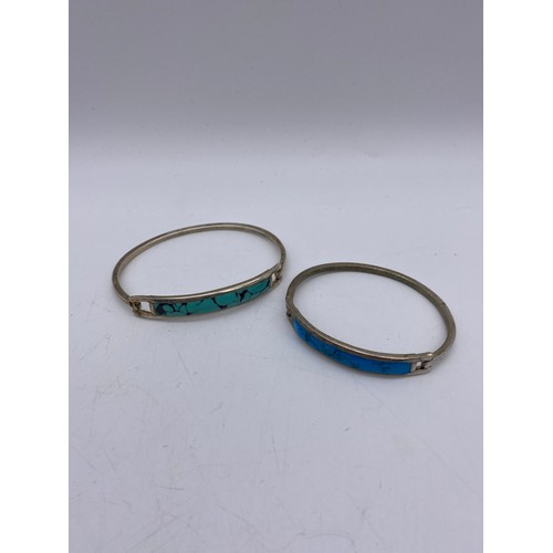 432 - TWO WHITE METAL AND TURQUOISE BANGLES