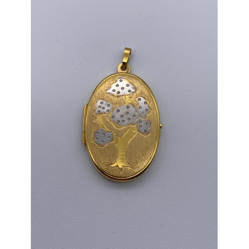 446 - 9CT GOLD OVAL TREE DESIGN LOCKET 5.3G APPROX