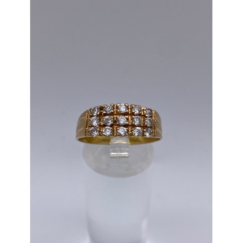 462 - UNMARKED YELLOW METAL CZ CHANNEL SET RING SIZE S 3.8G APPROX