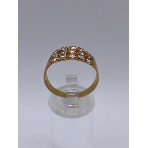 462 - UNMARKED YELLOW METAL CZ CHANNEL SET RING SIZE S 3.8G APPROX