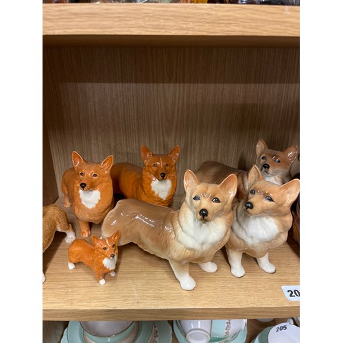 203 - SHELF OF CERAMIC CORGI DOG FIGURES INCLUDING BESWICK AND COOPER CRAFT AND A FIGURE OF HER MAJESTY TH... 