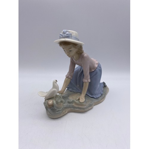 225 - NAO AND LLADRO FIGURES GIRL WITH A TURKEY AND GIRL WITH A DOVE