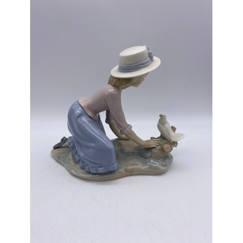 225 - NAO AND LLADRO FIGURES GIRL WITH A TURKEY AND GIRL WITH A DOVE