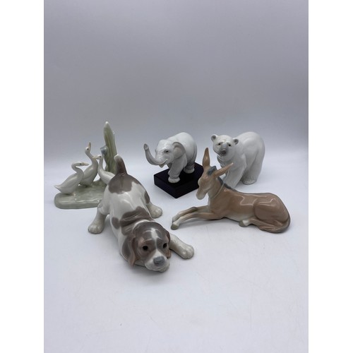 226 - THREE LLADRO FIGURES - DEER, ELEPHANT AND POLAR BEAR AND TWO NAO FIGURES - SWANS AND A PUPPY