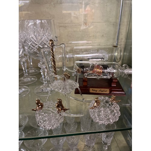 245 - TWO SHELVES OF CUT GLASSWARE INCLUDING SHERRY GLASSES, BRANDY GLASSES AND LATTICE ORNAMENTS