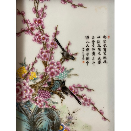 489 - ORIENTAL GLASS PANEL PAINTED WITH BIRDS AMONGST PRUNUS BLOSSOM WITH SCRIPT FRAMED 17CM X 24CM APPROX