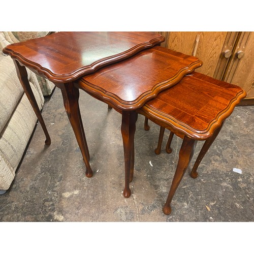 27 - MAHOGANY SERPENTINE NEST OF SPIDER LEG TABLES