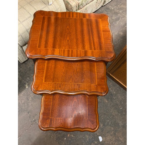 27 - MAHOGANY SERPENTINE NEST OF SPIDER LEG TABLES