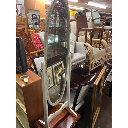 28 - WHITE PAINTED AND GILT OVAL CHEVAL MIRROR