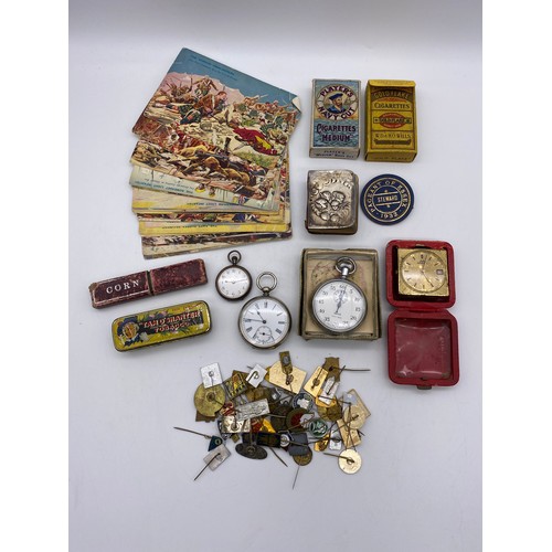 398 - TRAY OF VINTAGE ADVERTISING TINS, BASE METAL POCKET WATCH, ENAMEL LAPEL BADGES, SMITHS STOP WATCH