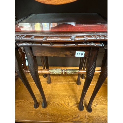 119 - NEST OF TWO MAHOGANY RED LEATHER GLASS TOPPED TABLES