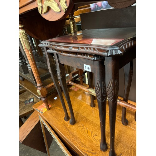 119 - NEST OF TWO MAHOGANY RED LEATHER GLASS TOPPED TABLES