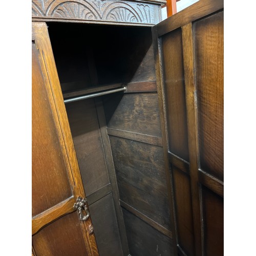 125 - OAK PANELLED CARVED SMALL WARDROBE