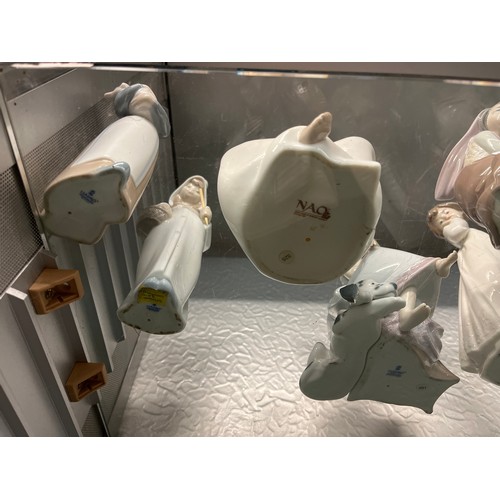 232 - EIGHT ASSORTED LLADRO AND NAO FIGURES INCLUDING CHILD, GIRL WITH LAMB, GIRL WITH CAT, ETC