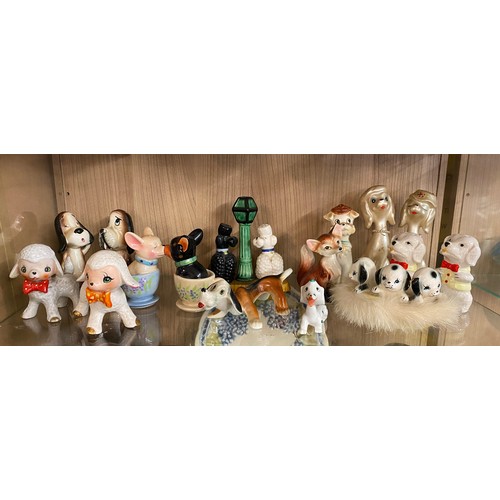 298 - SHELF OF NOVELTY DOG AND LAMB FIGURES INCLUDING CRUET SETS