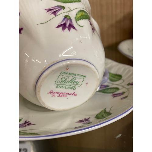 371 - SHELLEY CAMPANULA LOBED BONE CHINA TEACUPS AND SAUCERS PLUS A SHELLEY CROCHET CAKE STAND