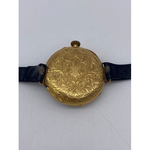 506 - 18CT GOLD ENGRAVED CASED WRIST WATCH ON FINE LEATHER STRAP 36.G OVERALL APPROX