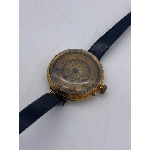 506 - 18CT GOLD ENGRAVED CASED WRIST WATCH ON FINE LEATHER STRAP 36.G OVERALL APPROX