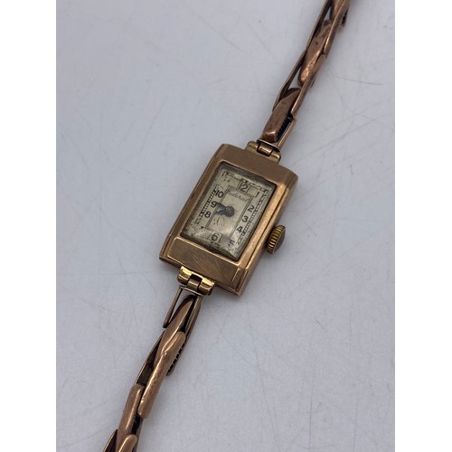 503 - LADIES ROSE GOLD SQUARE CASE WRIST WATCH ON 9CT GOLD EXPANDING BRACELET AS FOUND 10.3G APPROX OVERAL... 