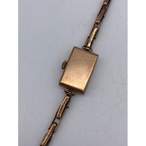 503 - LADIES ROSE GOLD SQUARE CASE WRIST WATCH ON 9CT GOLD EXPANDING BRACELET AS FOUND 10.3G APPROX OVERAL... 