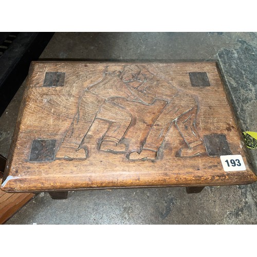 193 - CARVED STOOL DEPICTING WRESTLERS AND A SMALL WOODEN DESK ORGANISER