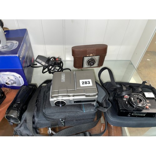 283 - KONIKA C35 CAMERA, CORONET 1220 BOXED CAMERA, OLYMPUS DIGITAL COMPACT CAMERA, AND A CANON OPTICAL ZO... 