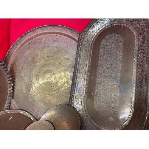 285 - TWO EASTERN BRASS CIRCULAR ENGRAVED TABLE TRAY TOPS, TWO HANDLED TRAY AND SMALLER BRASS ENGRAVED BOW... 