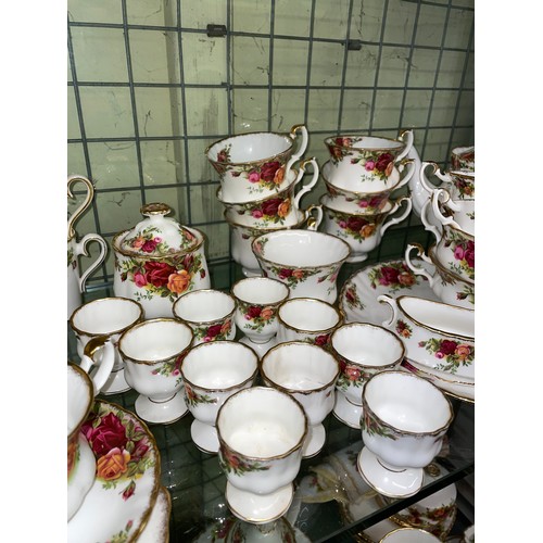 348 - TWO SHELVES OF ROYAL ALBERT OLD COUNTRY ROSES BONE CHINA TABLE WARES, SOME AS FOUND