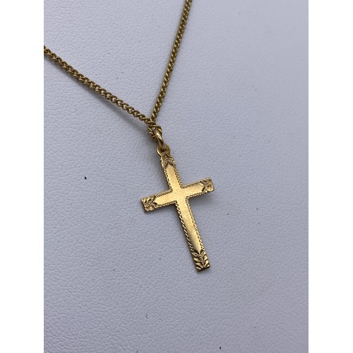 557 - 9CT GOLD CROSS ON ROLLED GOLD CHAIN, 9CT GOLD LEAPING DOLPHIN BROOCH 1.5G APPROX OVERALL