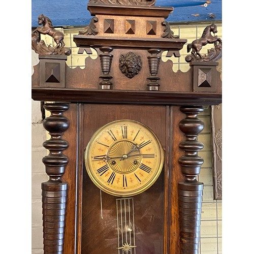 497 - 19TH CENTURY WALNUT CASED VIENNA STYLE PENDULUM WALL CLOCK WITH REARING HORSE CRESTINGS