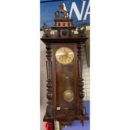 497 - 19TH CENTURY WALNUT CASED VIENNA STYLE PENDULUM WALL CLOCK WITH REARING HORSE CRESTINGS