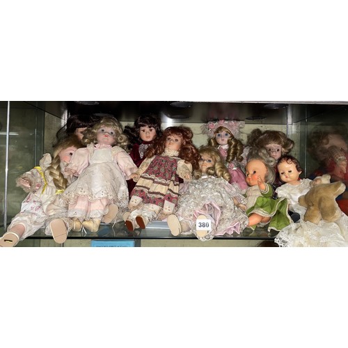 380 - SHELF AND HALF OF SMALL TO MEDIUM SIZED PORCELAIN HEADED DRESS DOLLS