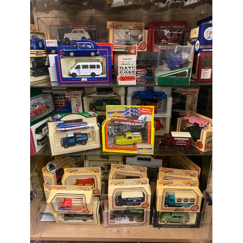 422 - SIX SHELVES OF BOXED MATCHBOX, LLEDO AND OTHER DIECAST MODEL CARS AND FARM VEHICLE TOYS