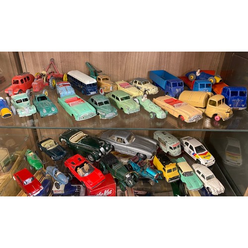 426 - TWO SHELVES OF PLAYWORN DINKY AND CORGI TOY CARS, FARM VEHICLES, AND TRUCKS