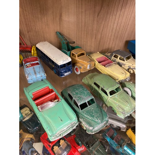 426 - TWO SHELVES OF PLAYWORN DINKY AND CORGI TOY CARS, FARM VEHICLES, AND TRUCKS