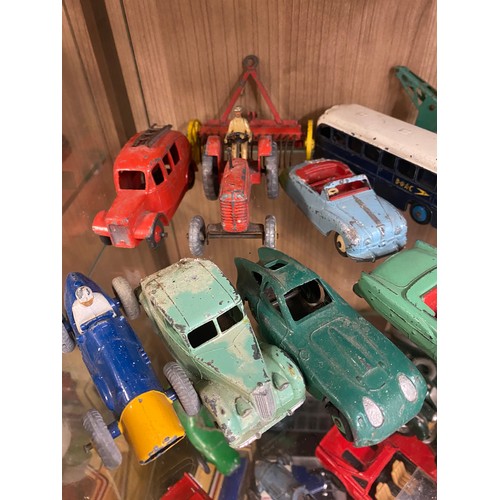 426 - TWO SHELVES OF PLAYWORN DINKY AND CORGI TOY CARS, FARM VEHICLES, AND TRUCKS