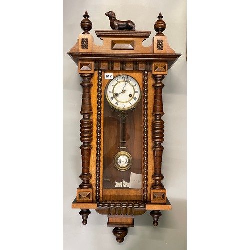 612 - 19TH CENTURY WALNUT CASED VIENNA STYLE PENDULUM WALL CLOCK WITH DASCHUND CRESTED FINIALS