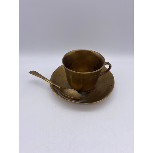 630 - BRASS TEACUP AND SAUCER WITH SPOON