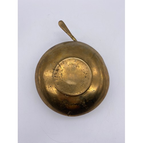 630 - BRASS TEACUP AND SAUCER WITH SPOON