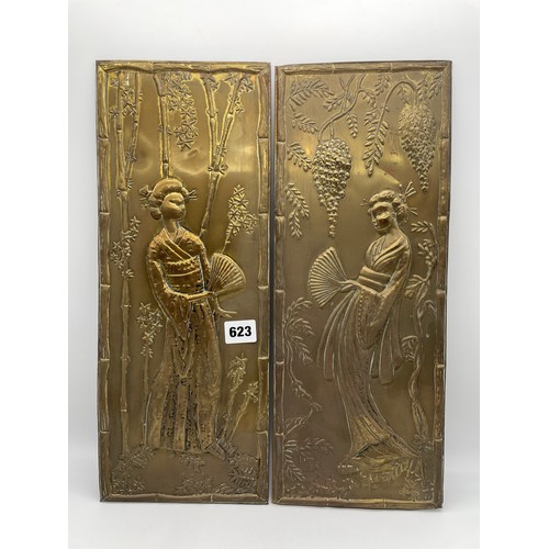 623 - PAIR OF BRASS PANELS DEPICTING GEISHAS AMIDST FLOWERS