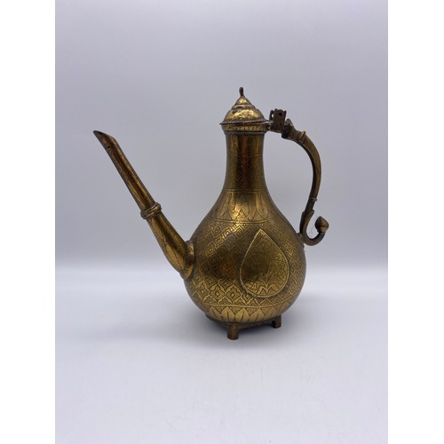 700 - 19TH CENTURY EASTERN BRASS ENGRAVED EWER