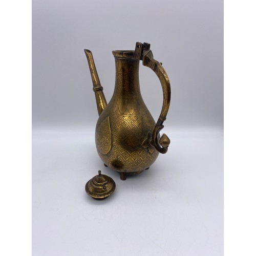 700 - 19TH CENTURY EASTERN BRASS ENGRAVED EWER