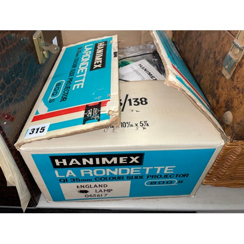 602 - HANIMEX LA RONDETTE COLOUR SLIDE PROJECTOR AND RELATED CAROUSELS AND SLIDES